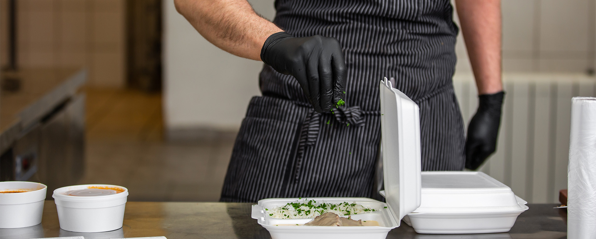 man preparing food in kitchen