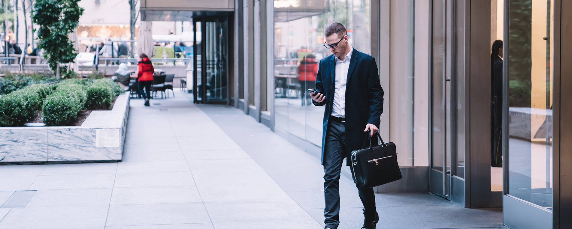 business man waking down street